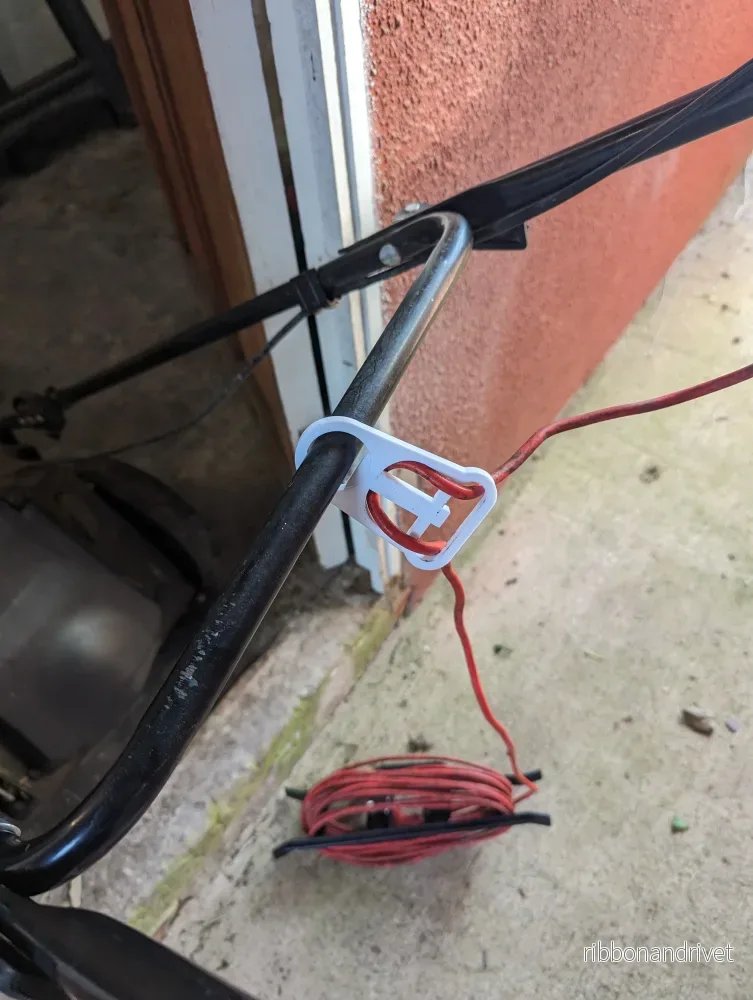 Kabelhållare för elektrisk gräsklippare