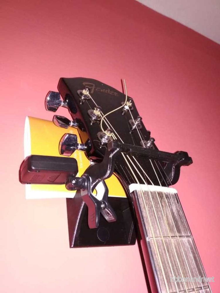 Säkert väggfäste för gitarr